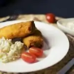 Pittige Eggs Benedict met spek