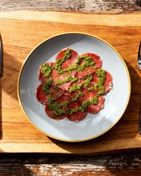 Carpaccio met eigen dressing