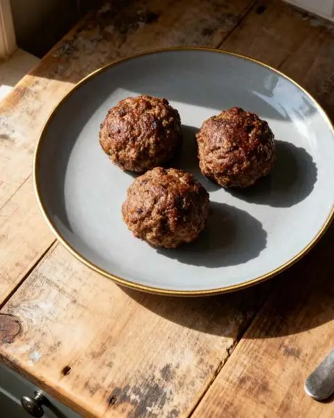 Gehaktballen met kerrie en ui