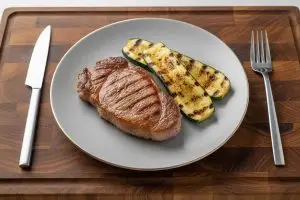 Hamlapje met geroosterde courgette